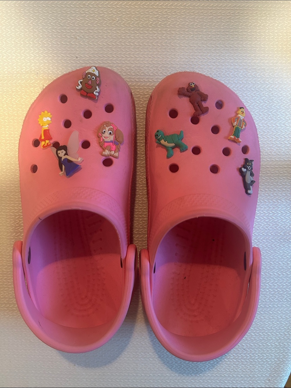 CROCS Kids Pink Clogs with Character Jibbitz